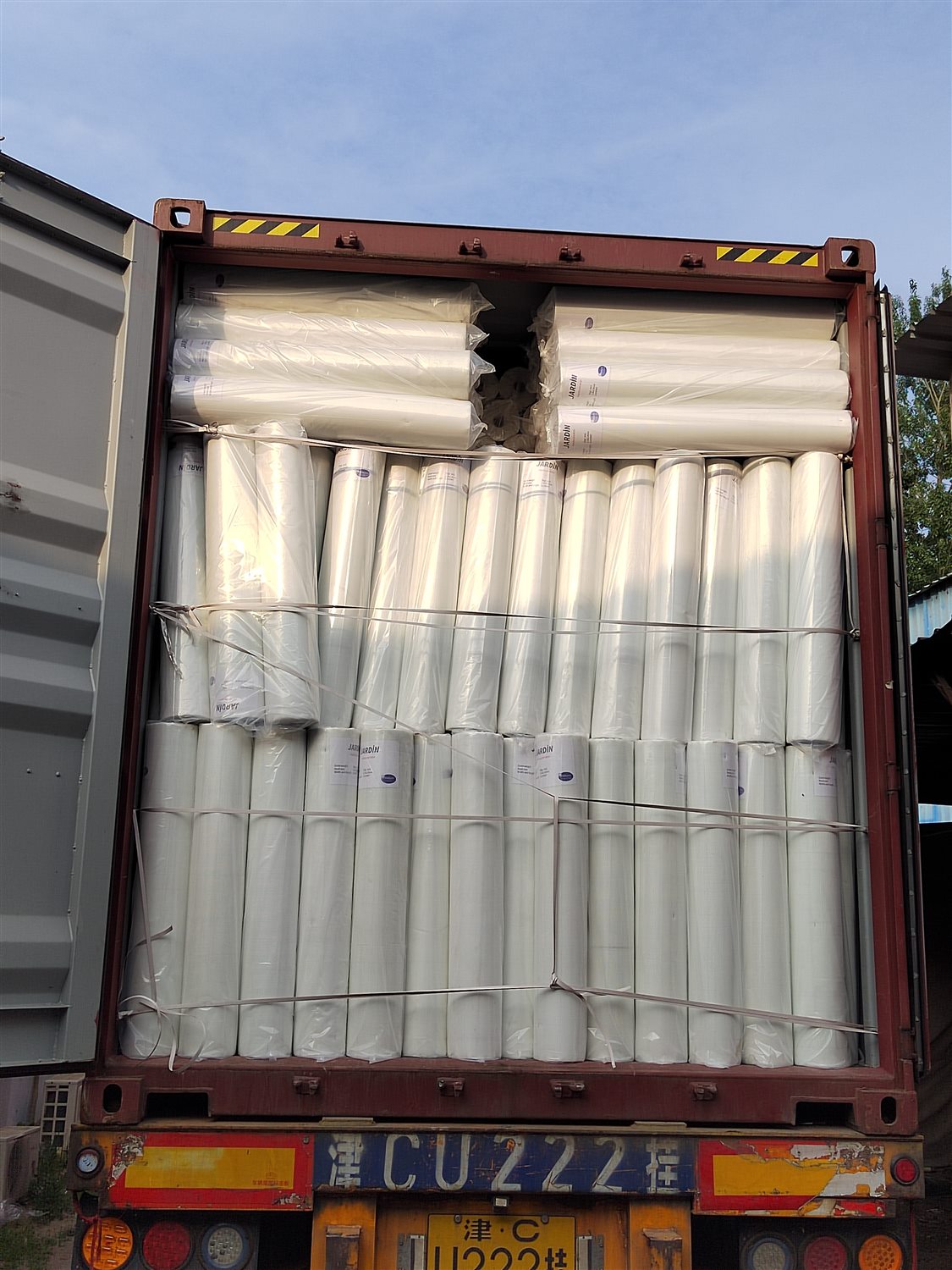 White mesh rolls loaded in an export container